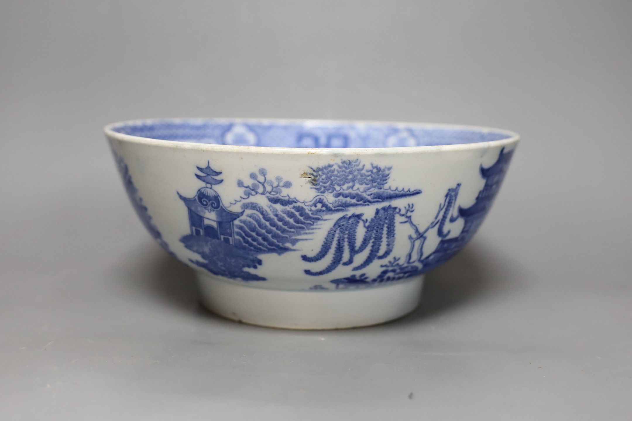 An early 19th century pearlware blue and white punch bowl, 27cm